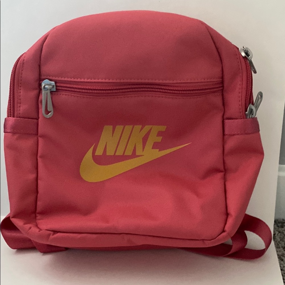 Nike Pink Futura 365 Mini Backpack. Size 10x8x4 inches. Gold Nike Swoosh. NWT